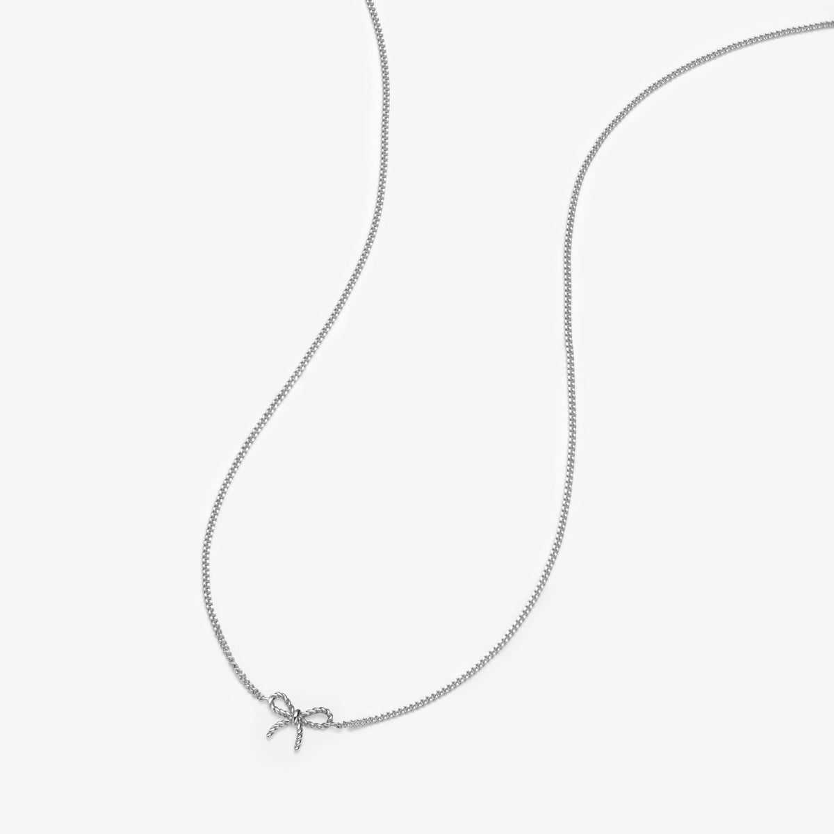 tiny ホワイトゴールドリボンネックレス White Gold Atticus Micro Bow Necklace | Fine Jewelry | Adornmonde