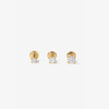 Three gold stud earrings with clear lab diamonds, arranged horizontally on a light gray background.