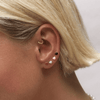 Saint red heart piercing