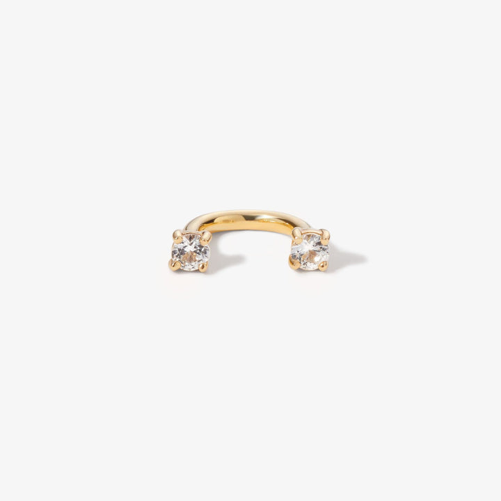 Gold U hoop with a lab-grown diamond at each end.