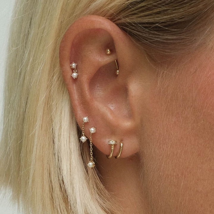 August drop pearl piercing