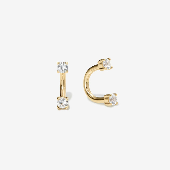 Pair of gold U hoop earrings with lab-grown diamonds at each end.