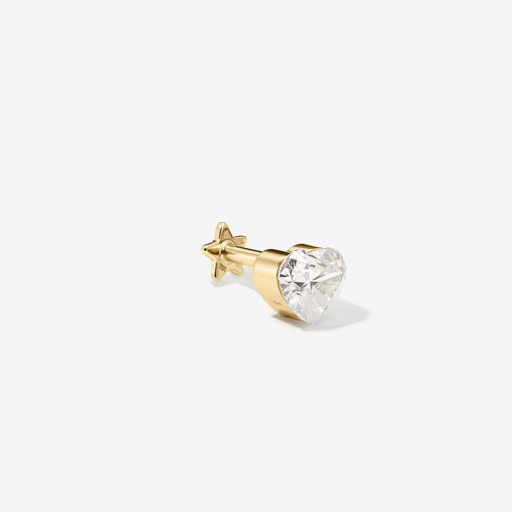 Side view of the Clark gold heart-shaped diamond stud, showing its straight post and star-shaped backing.