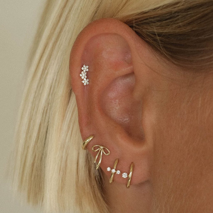 Jarrett triple micro flower piercing