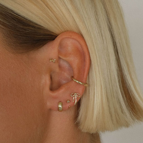 Rollins bow piercing