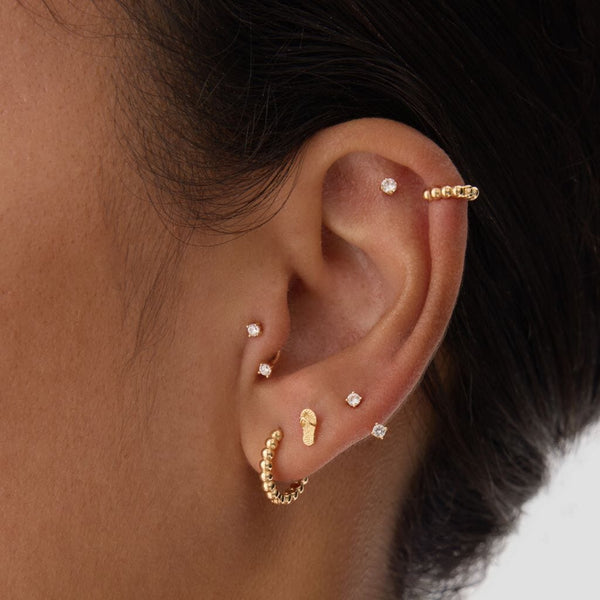 Slater flip flop piercing