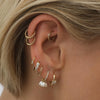 Kalel pearl huggie earrings